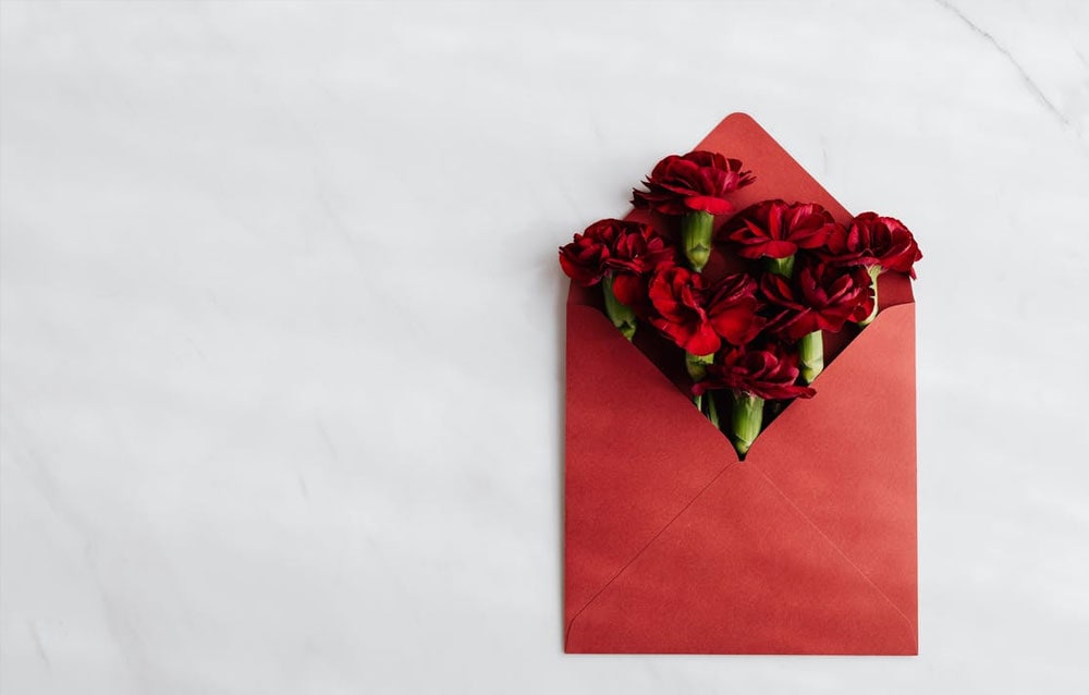 red envelope with roses