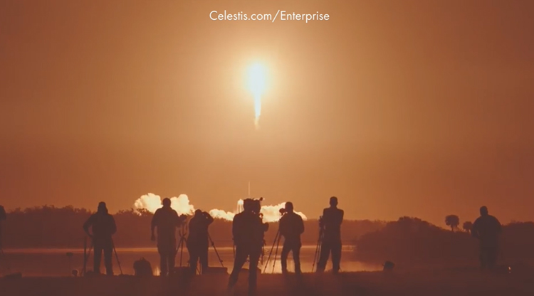 media people watching a space rocket launch into space