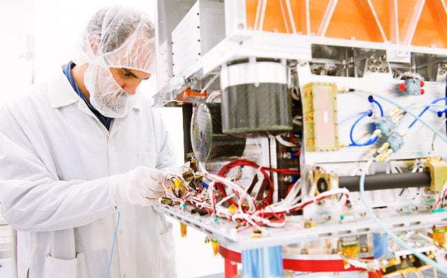 Engineer working on OTB spacecraft 