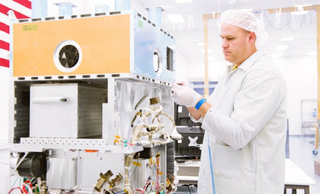 Engineer working on OTB spacecraft.