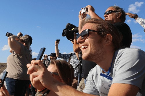 A launch guest reacts to the launch of a Celestis Memorial Spaceflight