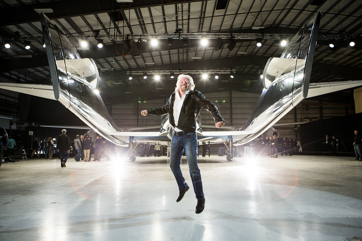 Sir Richard Branson jumps for joy at the rear of VSS Unity.