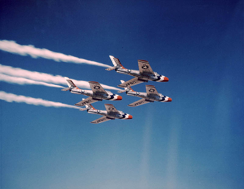Four Republic F-84F Thunderstreak -- one of the types of aircraft flown by William Pogue for the U.S. Air Force Thunderbirds aerobatics team -- flying in formation in 1955/56.