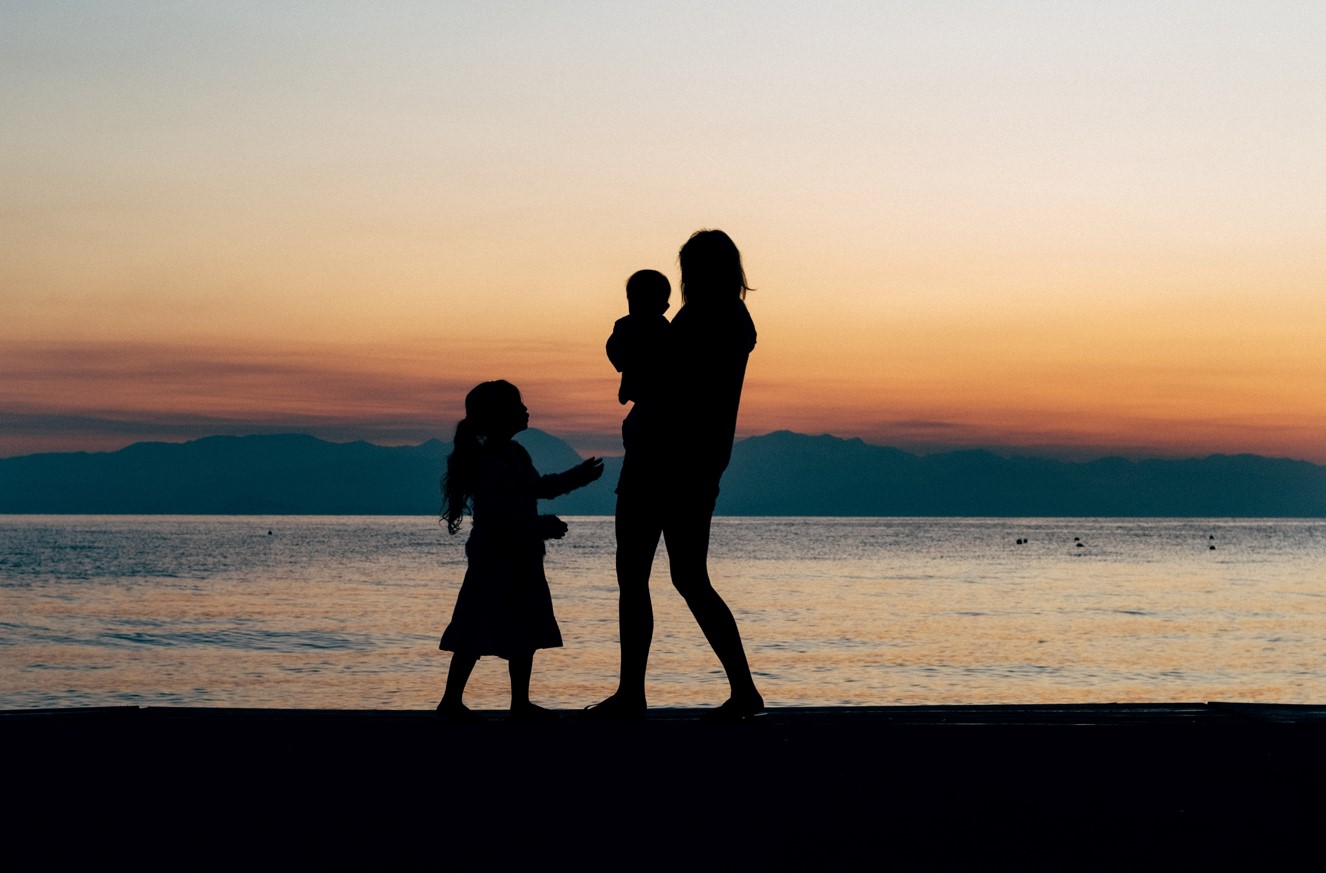 Brother, sister and mother, stroll on the beach .jpg