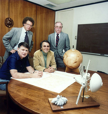 Planetary Society founders – 1980 photo. Clockwise from bottom left: Bruce Murray, Louis Friedman, Harry Ashmore (advisor), Carl Sagan.