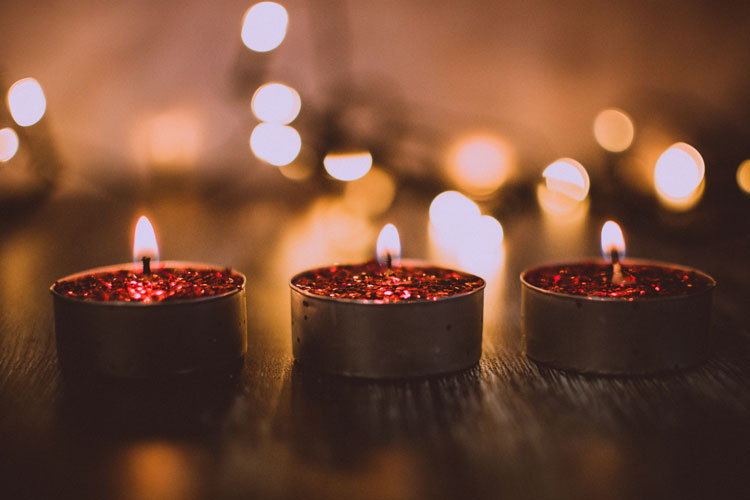 lighted three small red candles