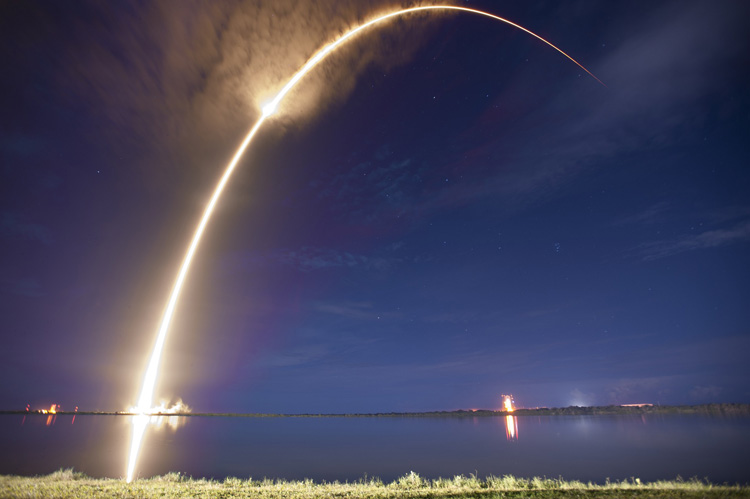 space rocket launch at night