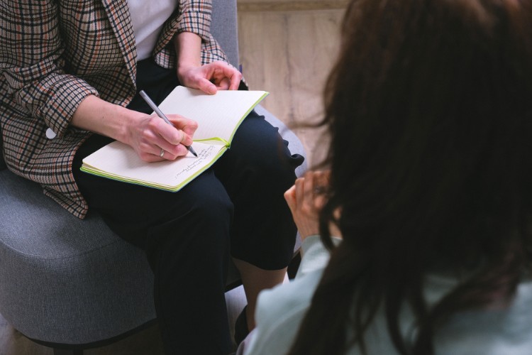 grief counselor talking to a client