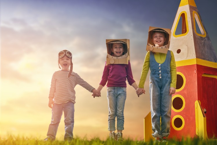 children in astronaut costumes