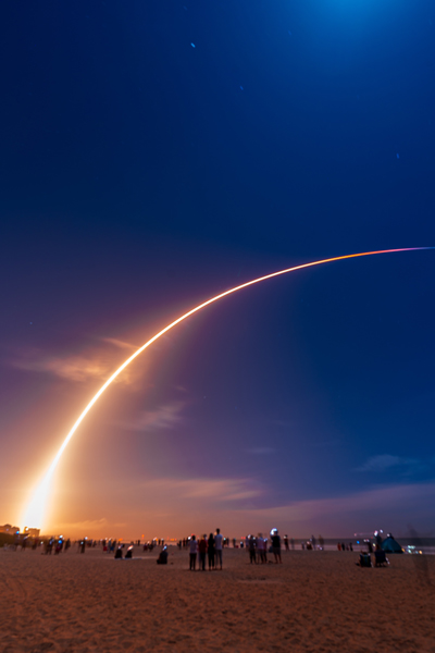 crowd watching space rocket launch