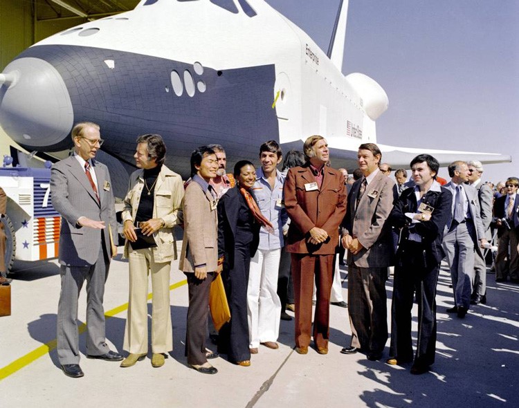 The creator and cast members of Star Trek attend the September 1976 rollout of space shuttle Enterprise with NASA Administrator James C. Fletcher, left
