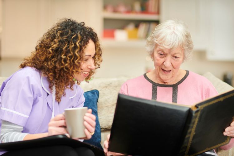 mother and daughter looking at photographs