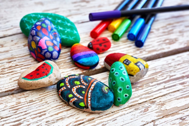 river stones painted with colorful designs