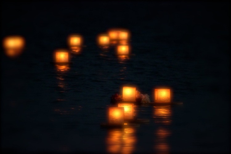 floating lanterns in a river