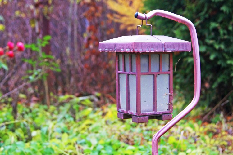 memorial solar lantern installed in a garden