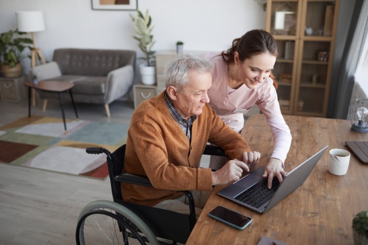 elderly man in a virtual memorial zoom meeting