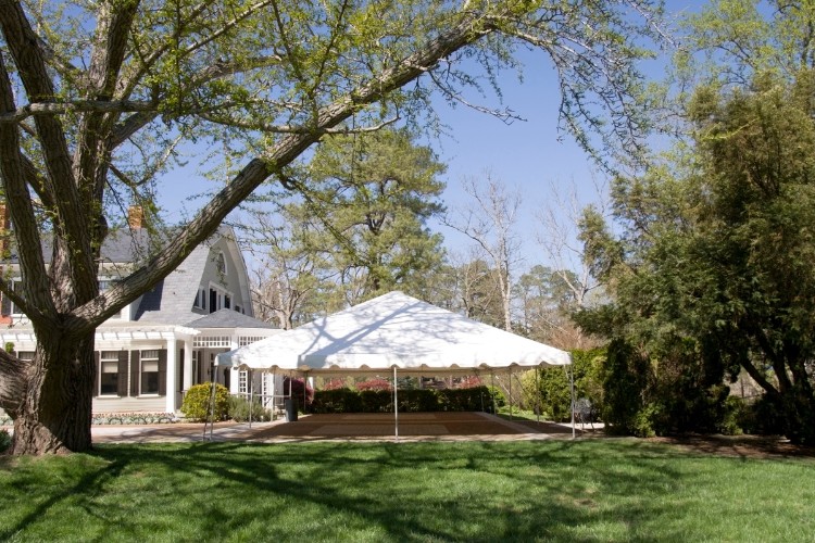 Outdoor memorial service tent set up in a garden setting