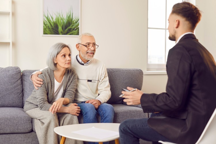 Elderly couple meeting with advisor to plan cremains spaceflight memorial