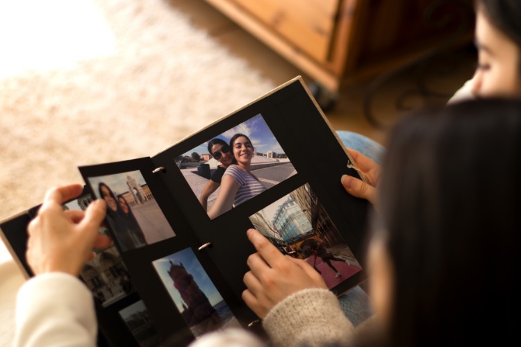 Viewing photographs to include in a celebration of life invitation