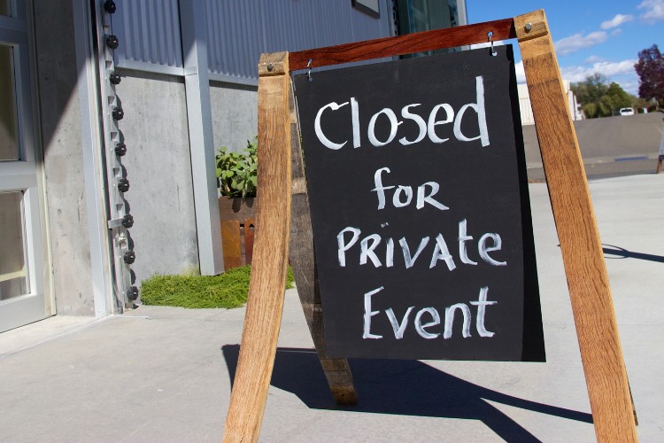 Outdoor sign indicating a private celebration of life gathering