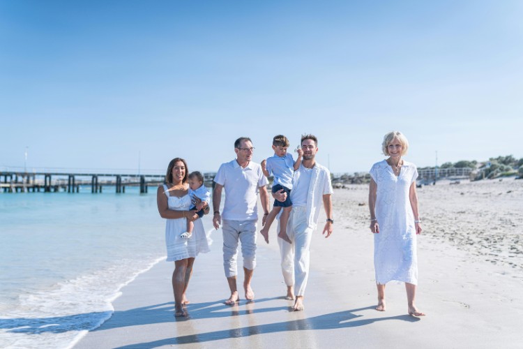 Family walking together on the beach resort for a celebration of life