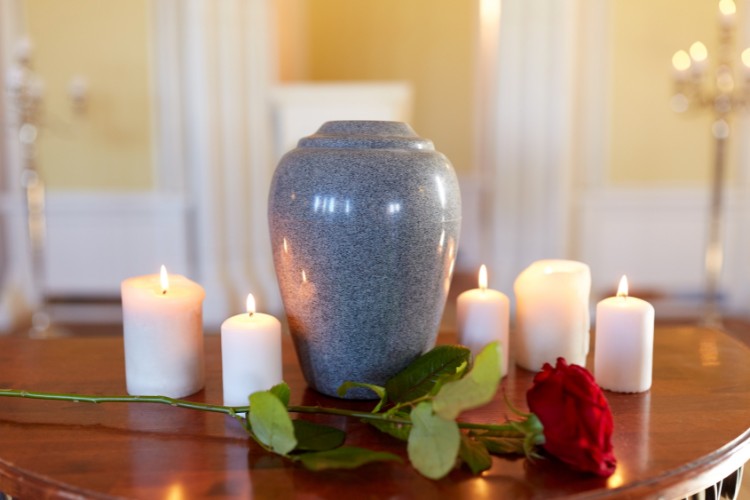 Secure urn for storing cremation ashes before final resting place