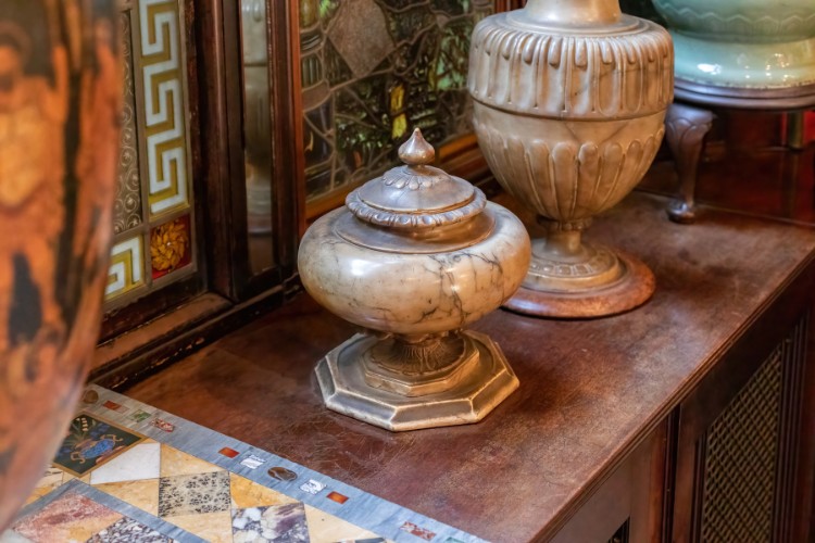 Securely placed marble urn for temporary cremated ashes storage