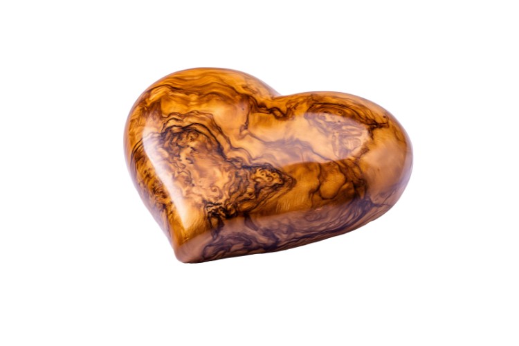 Heart-shaped wooden urn designed as a beautiful memorial keepsake for holding cremation ashes