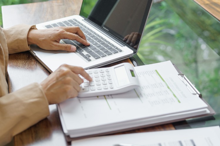 Space enthusiast reviewing space tourism package costs and comparing flight experiences